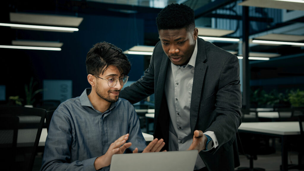 Two professionals collaborating at a Tulsa recruiting firm, showcasing local expertise and strategies that support hiring success.