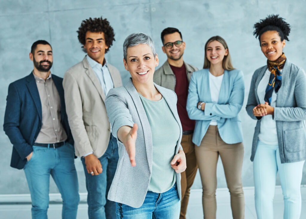 Diverse team of professionals greeting a job seeker and demonstrating career growth in Oklahoma, job search support, and professional recruiting.
