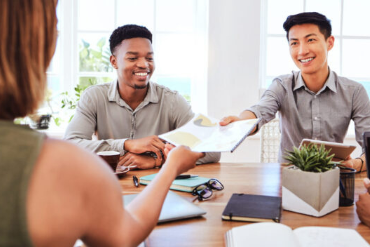 Business team discussing candidate quality with staffing partner to strengthen client relationships and improve hiring outcomes