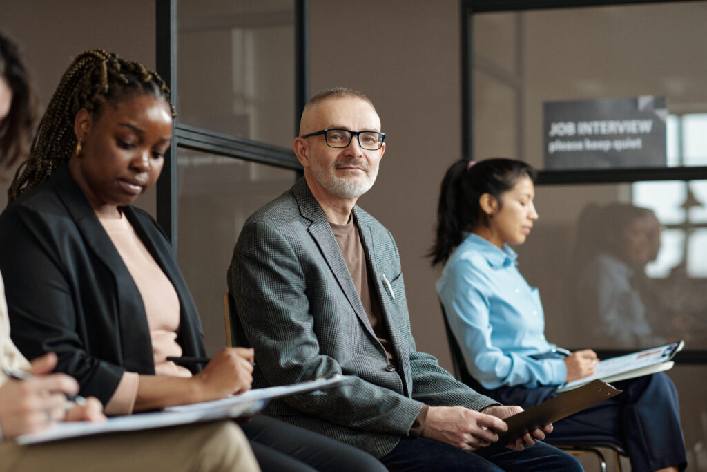 Job candidates waiting for interviews in the Tulsa job market with support from an employment agency in Tulsa