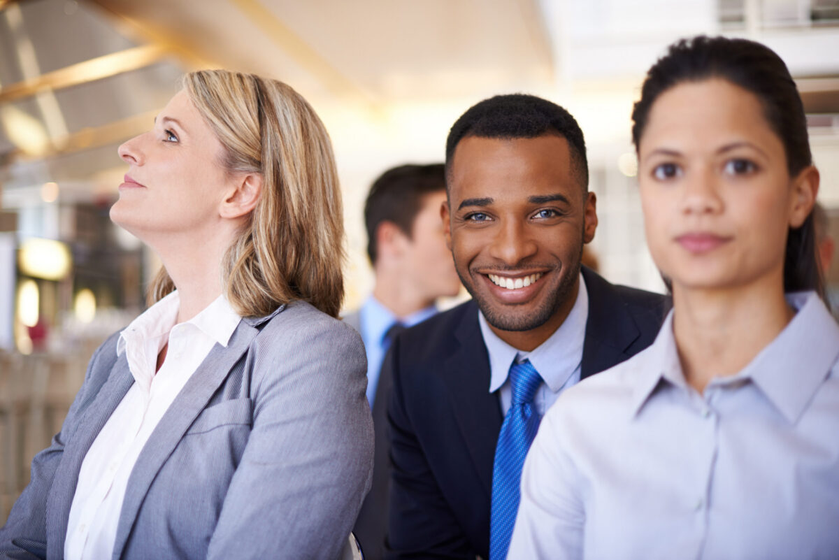 Professional candidates networking with staffing experts through an employment agency for hidden job opportunities and career advancement