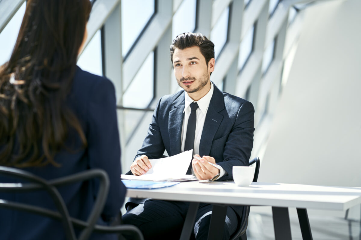 Professional job interview prep meeting with a recruiter helping a candidate create a resume and prepare for career opportunities with staffing experts