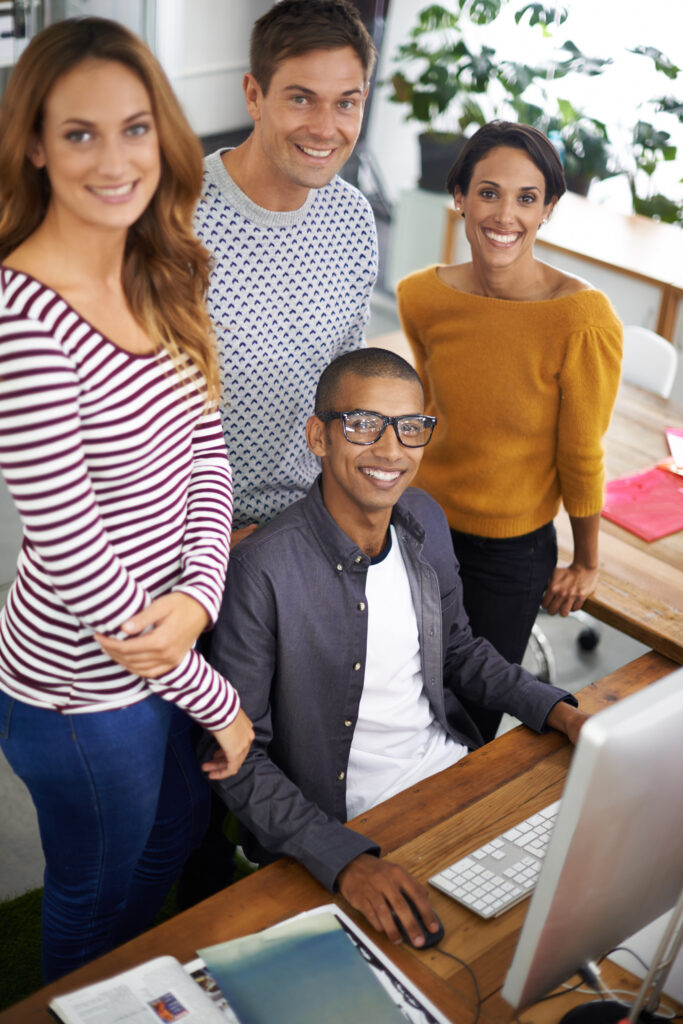 Office staffing professionals collaborating in a modern workplace with an Oklahoma staffing agency focused on hiring top talent