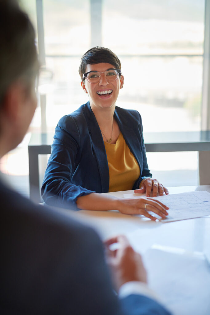 Professional candidate demonstrating job interview prep while meeting with staffing experts and confidently prepping for a job interview.