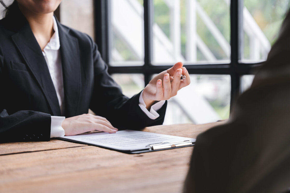 Recruiter conducting a professional interview while prepping for a job interview and providing job interview prep guidance to a candidate.
