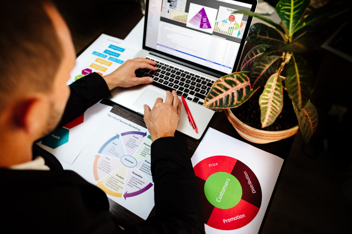 Professional reviewing marketing strategy while searching for a marketing job with help from marketing recruiters and job recruiting experts.